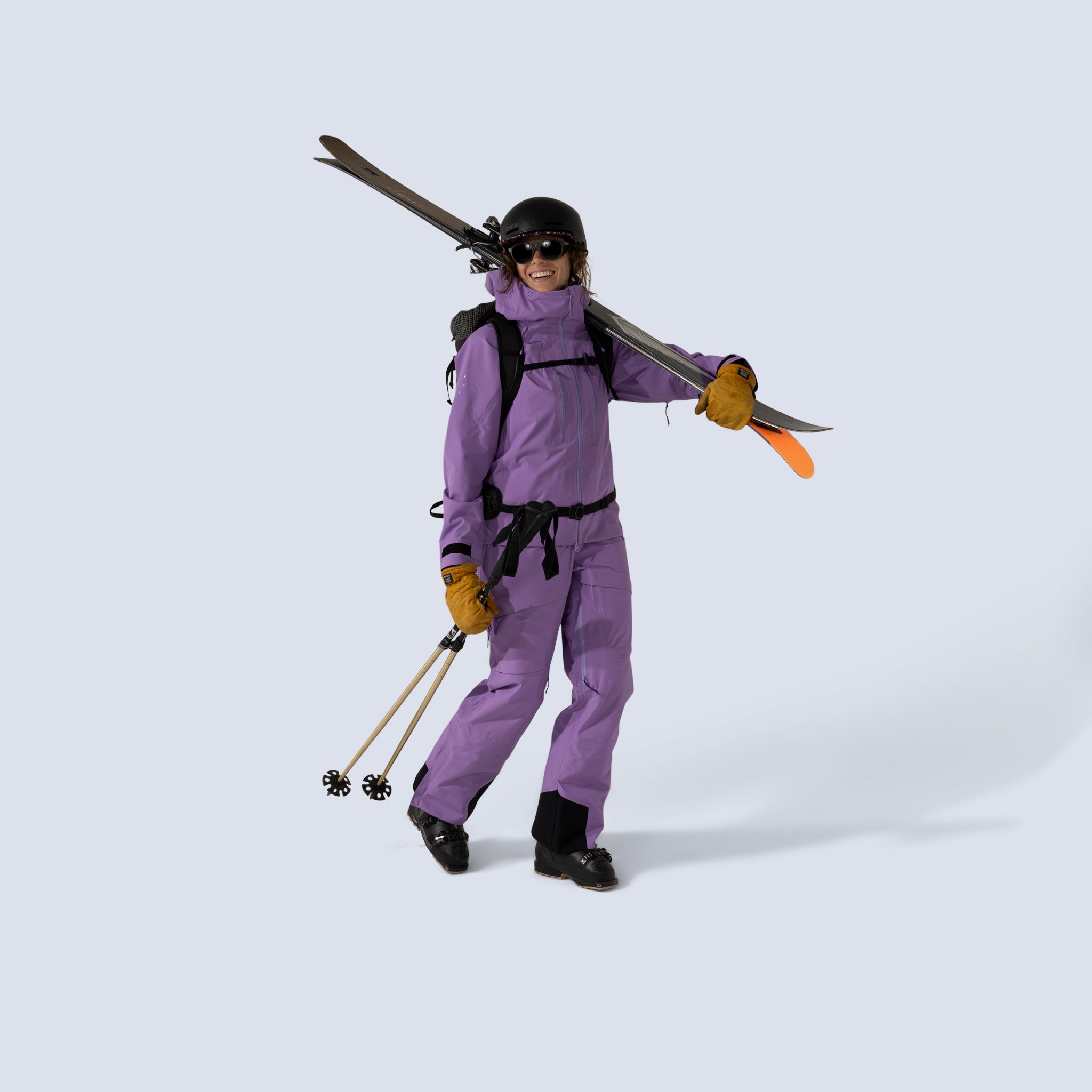 [Amethyst] Heyburn 3l bibs in amethyst with matching heyburn 3l jacket in amethyst, model holding ski gear