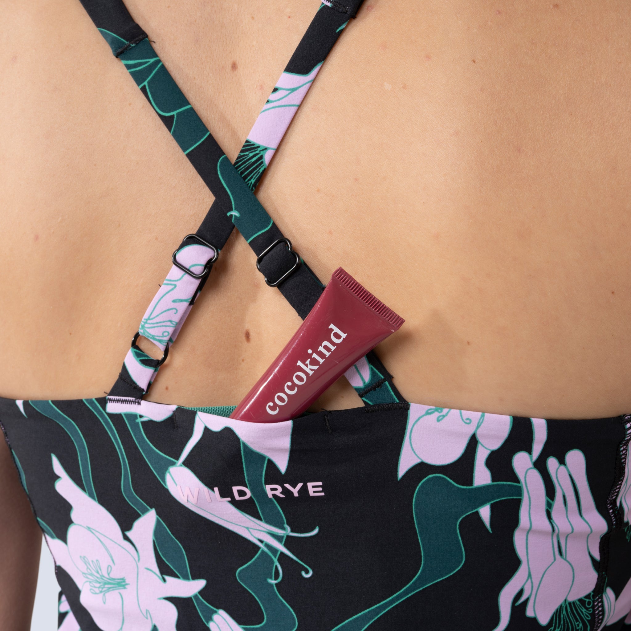 [Black Aquila Bloom] Parker Action Dress in Black with pink floral pattern, lip balm within hidden pocket