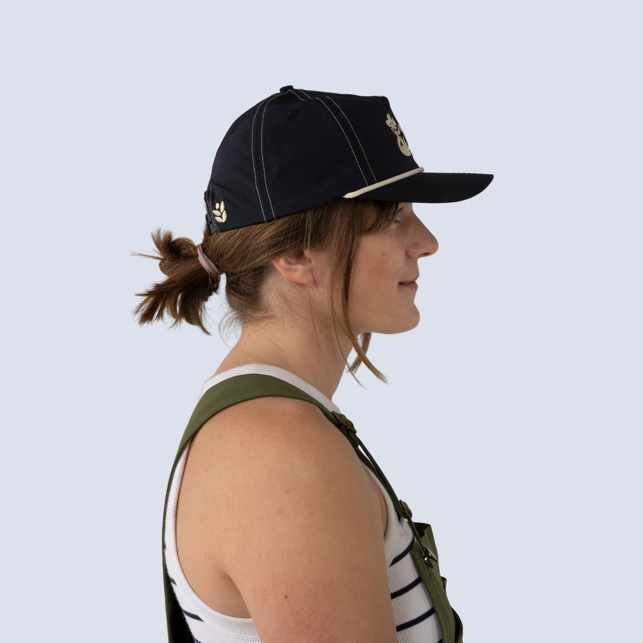 Side profile view of hands off trucker hat