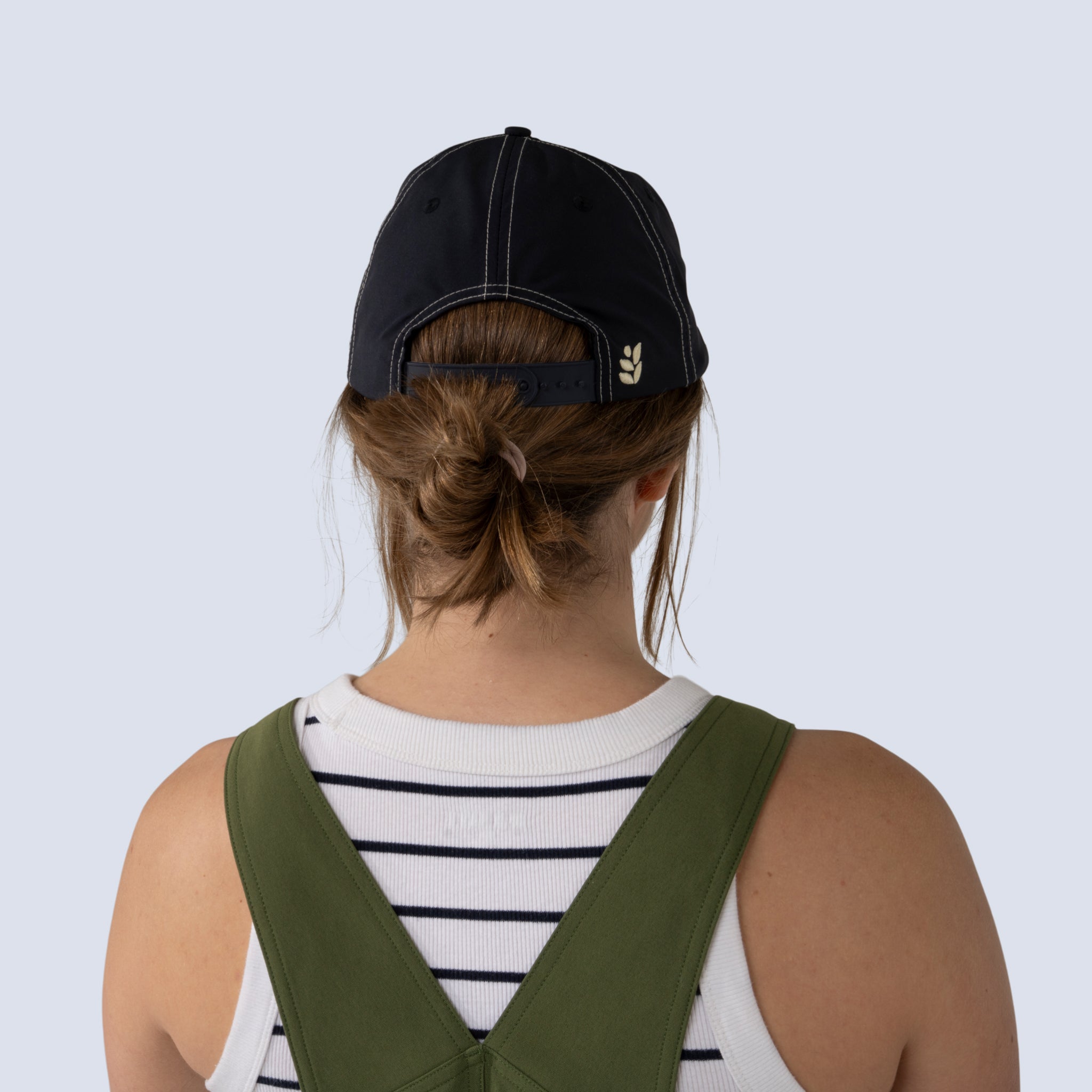 Back view of hands off trucker hat