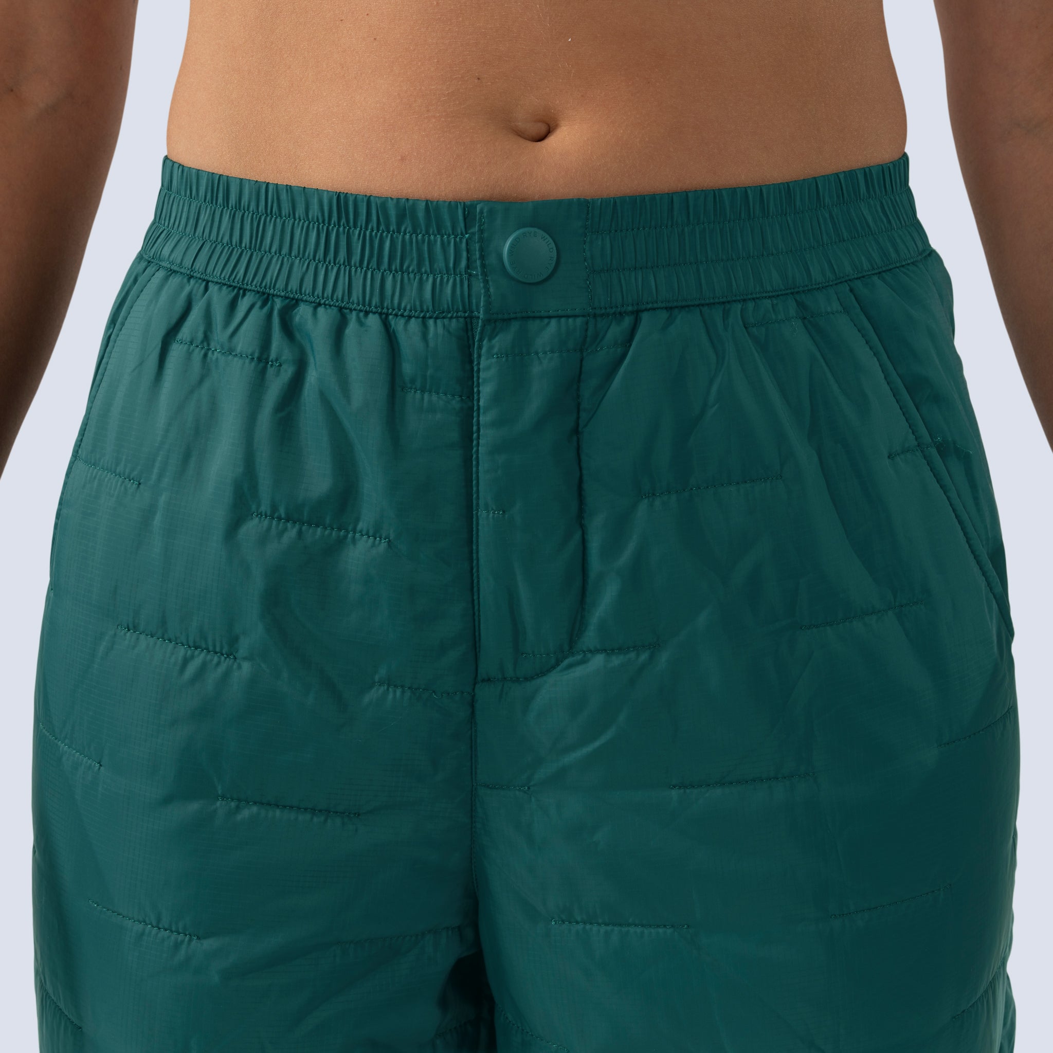 [Shaded Spruce] Payette Insulated Pant in shaded spruce green, rise detail, 1/2" below belly button