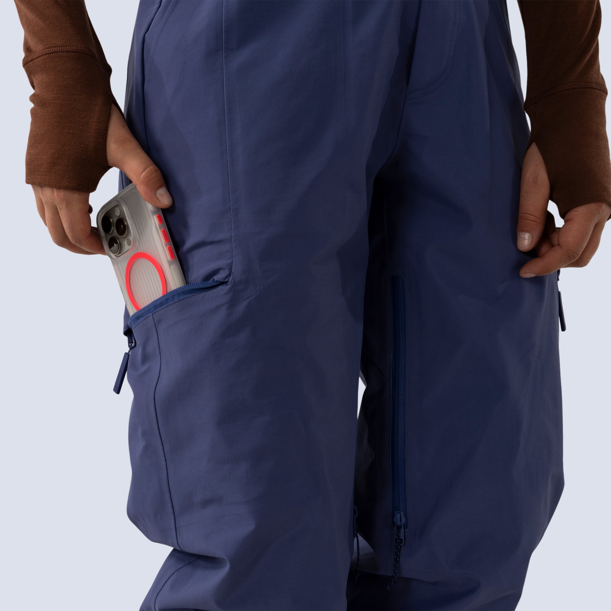 [Storm] Butterfield 3L pant in storm blue, sliding iphone into zippered side thigh pocket