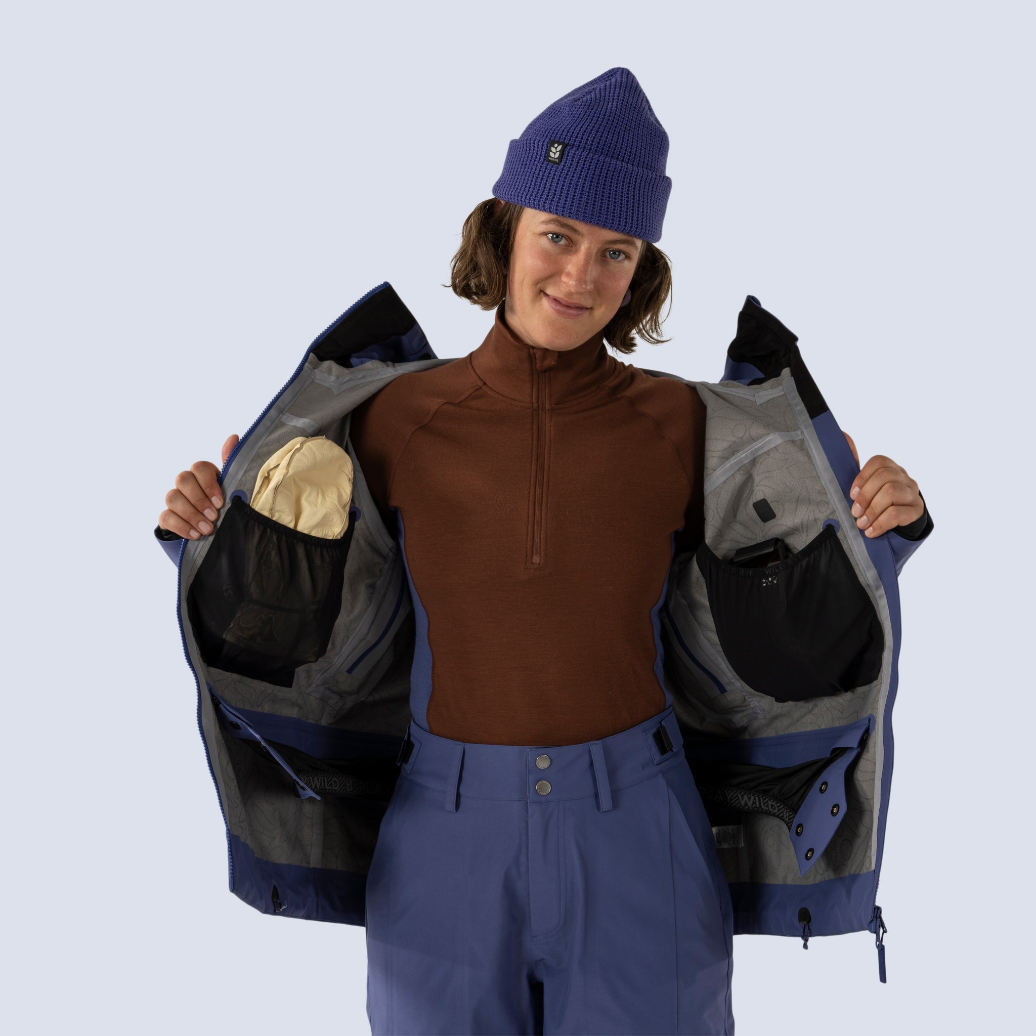 [Storm] Butterfield 3L jacket in storm blue, detail of inside of jacket, showing 2 stash pockets and removable powder skirt