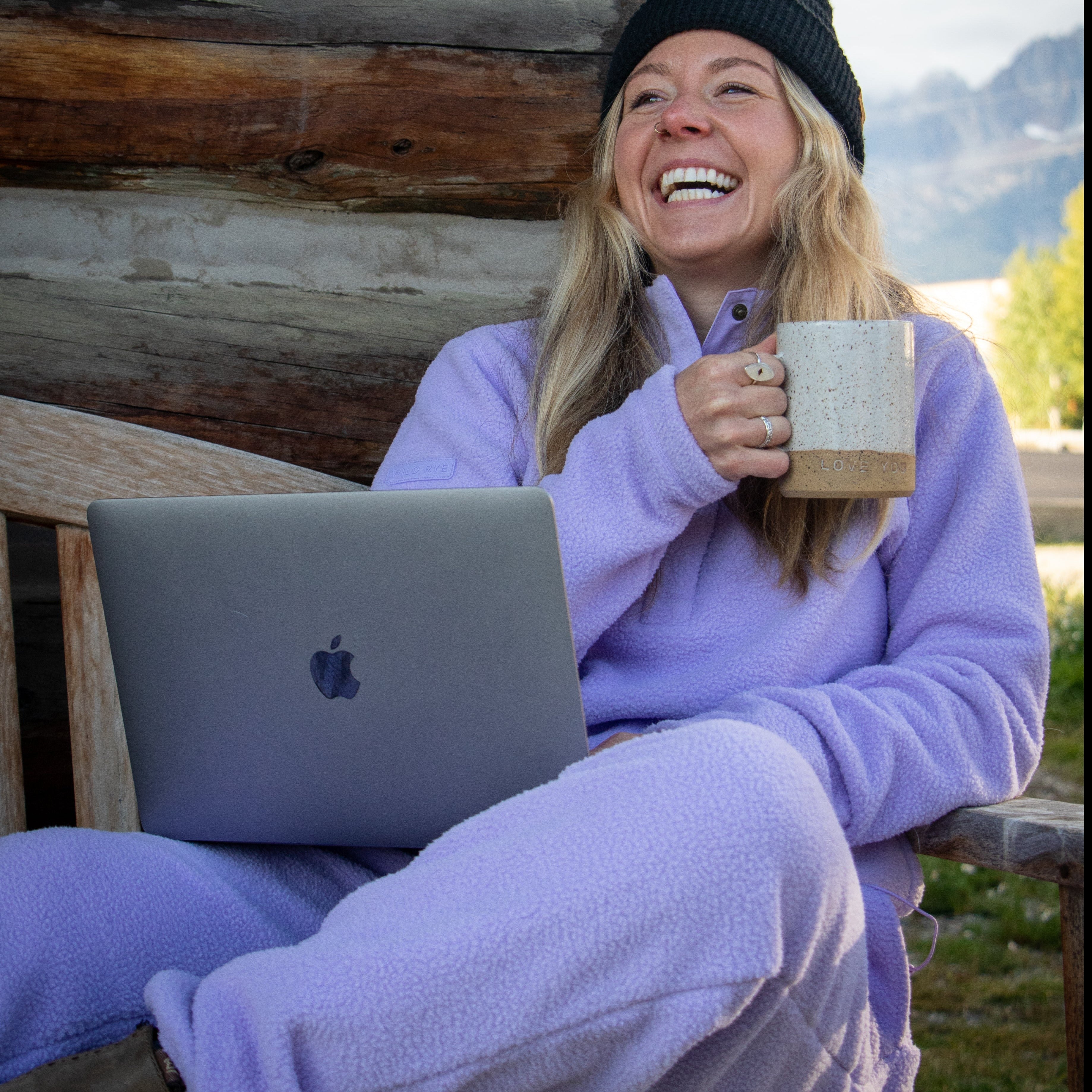 [Lilac] woman drinking coffee wearing danner jogger and pullover