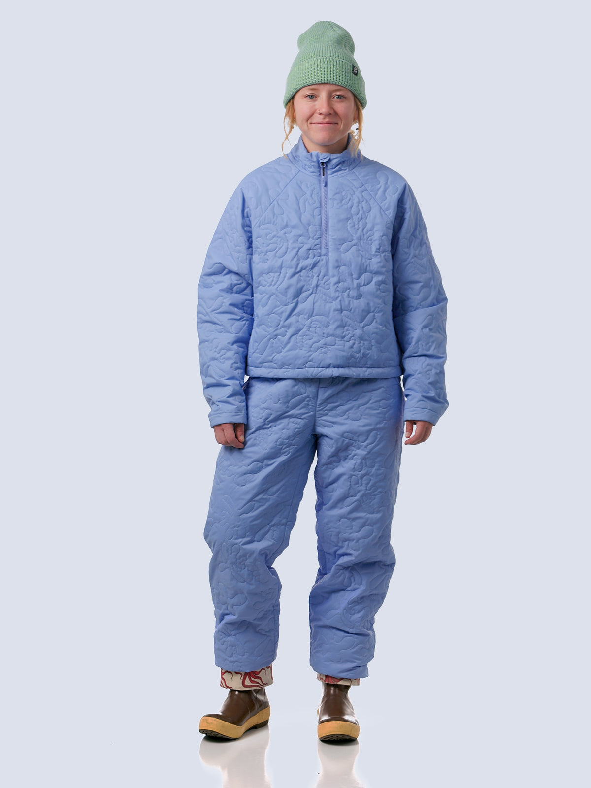Model walking into video wearing payette pullover and payette pant in breeze reef, showing the fit and features of the pants