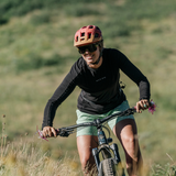 Woman rising downhill in freda 7" mountain bike short