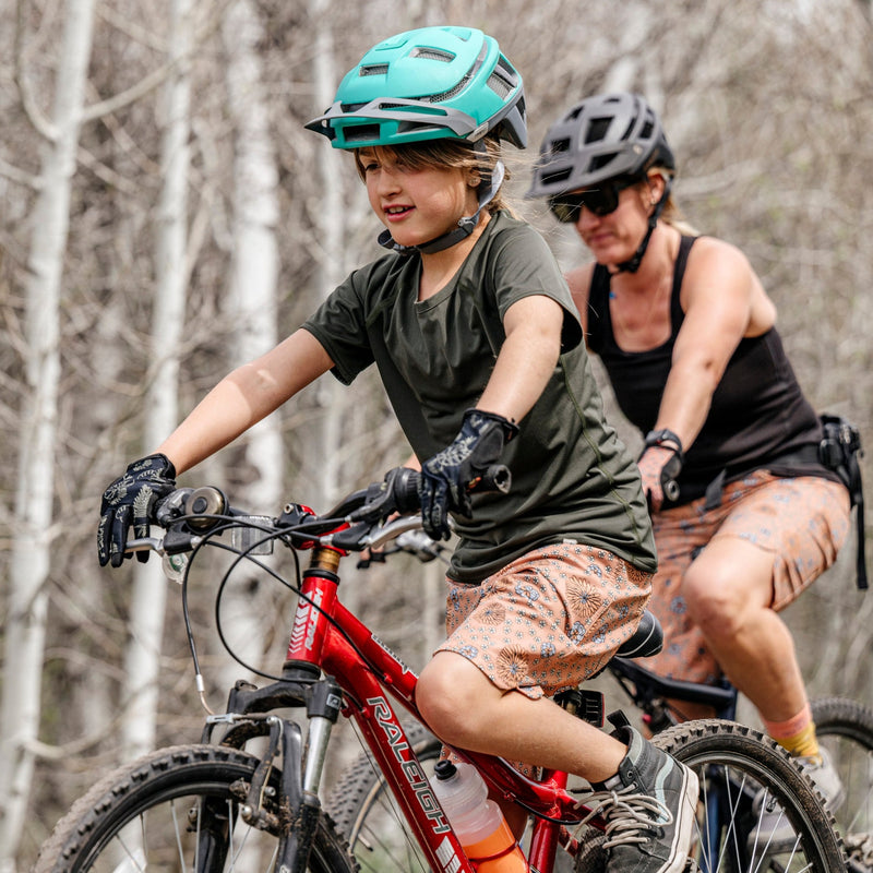Girl and mother wearing matching bike shorts